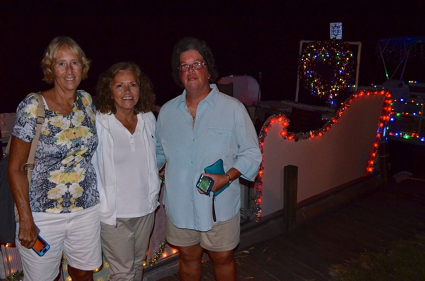 Sharon Slottje, Phyllis Parks and Amy Waterbury enjoy drinks and socializing.