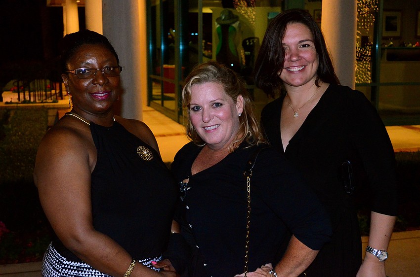 Carlene Lemley and Susan Jackson pose beside Just for Girls Principal Deanna Smith.