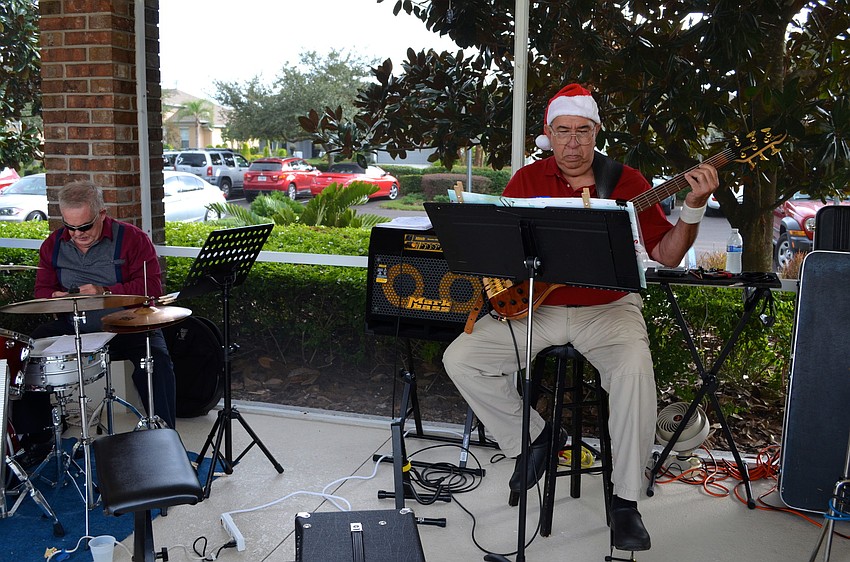 Bill Ibrahim tunes his instrument before the band starts.