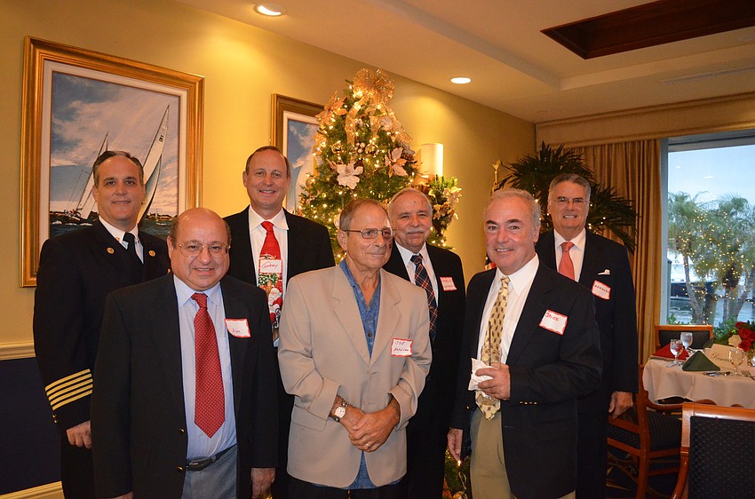 Longboat Key Fire Chief Paul Dezzi with Country Club Shores board members Alan Rose, president Gary Coffin, Joe Moccia, Charlie Campbell, Jack Kazanciyan and Armando Linde