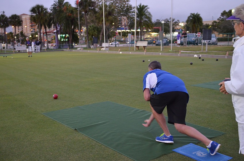 Drew Moon of Freedom Boat Club takes turn with lawn bowling at the Monday Mixer.
