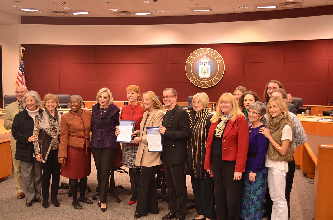 Iain Webb, Margaret Barbieri, Mary Anne Servian and supporters of the Sarasota Ballet accept two certificates of recognition from the Sarasota County Commission