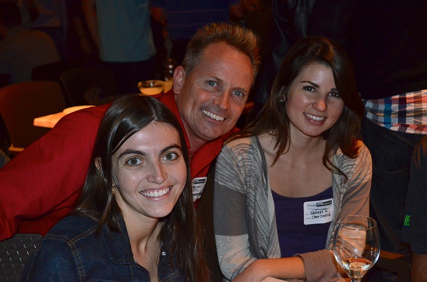 Natasha Zipay, Ken Burke and Natalie Rosenzweig share laughs during dinner.