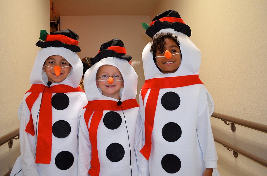 Three snowmen â€” Vincent Vanacore, Garrett Brooks and Jordan Janeck â€” show off their costumes.