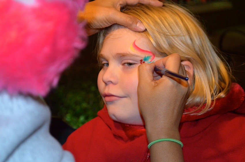 Kassidy Zellner patiently waits to see her painted face.