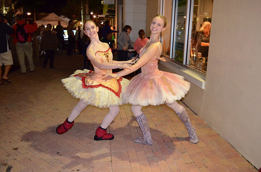 Sarasota Ballet performers Rebecca Strain and Caitlin Gish strike poses.