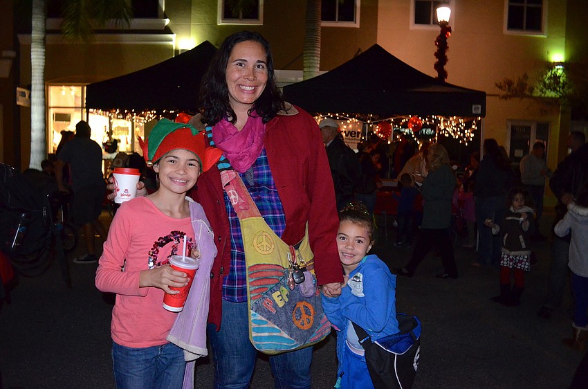 The Jones family â€”Â Jaed, Mandy and Tristan â€” explore Main Street.