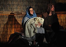 Alayna Montgomery and Caleb Jordan, as Mary and Joseph, hold the newborn baby Jesus, played by 2-month-old Daniel Lawson.