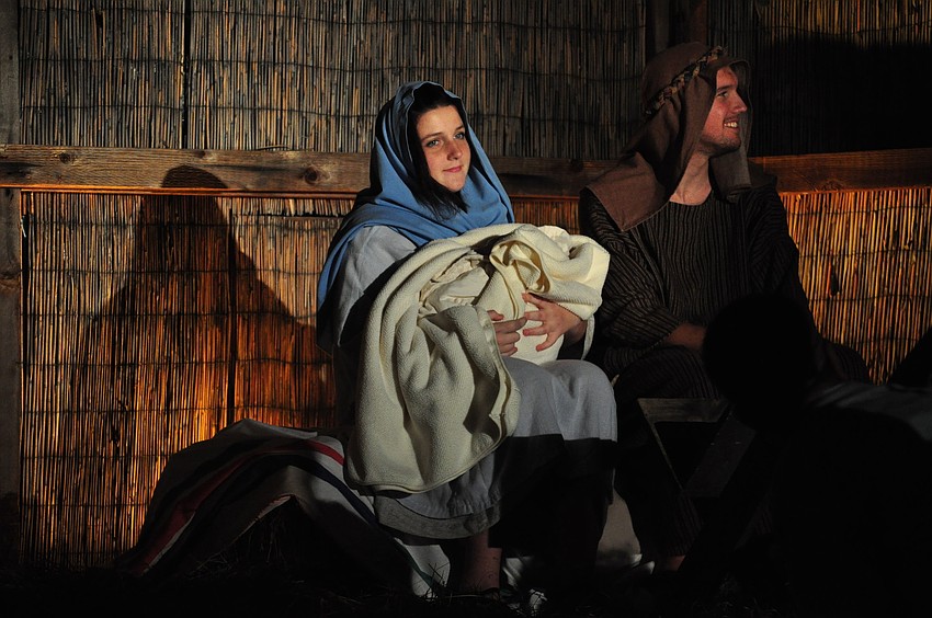 Alayna Montgomery and Caleb Jordan, as Mary and Joseph, hold the newborn baby Jesus, played by 2-month-old Daniel Lawson.