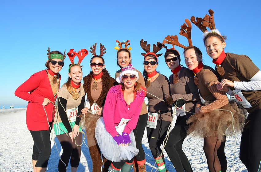 Erica Lawson and her bachelorette party reindeers prepare for the Sandy Claws Beach Run.