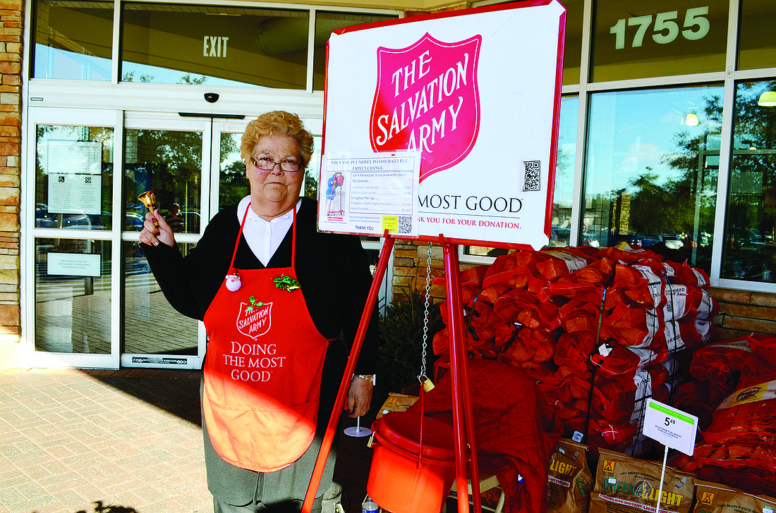 This is Cheryl Lee's first year as a Salvation Army bell ringer. Her post is the Publix at the intersection of State Road 64 and Lakewood Ranch Boulevard. Photo by Amanda Sebastiano
