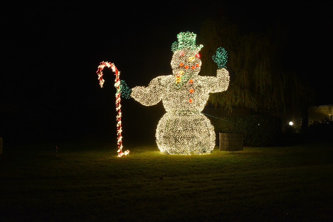 Frosty has lived in River Club since he was erected by his creator, the late Dan Burgett, in 1997. He has lived off River Club Boulevard at the home of Don and Mary Lou DeBolt since 2003. Photos by Pam Eubanks