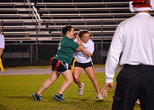 Freshmen and juniors compete on the football field.