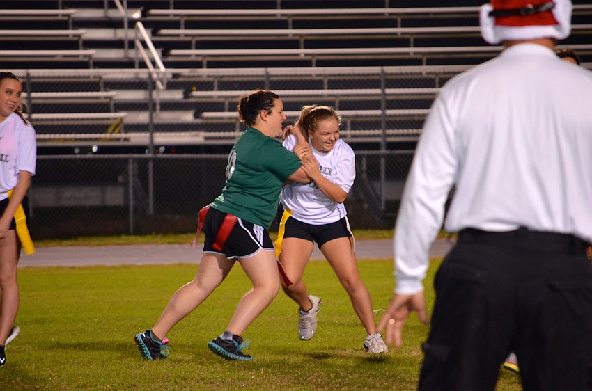 Freshmen and juniors compete on the football field.