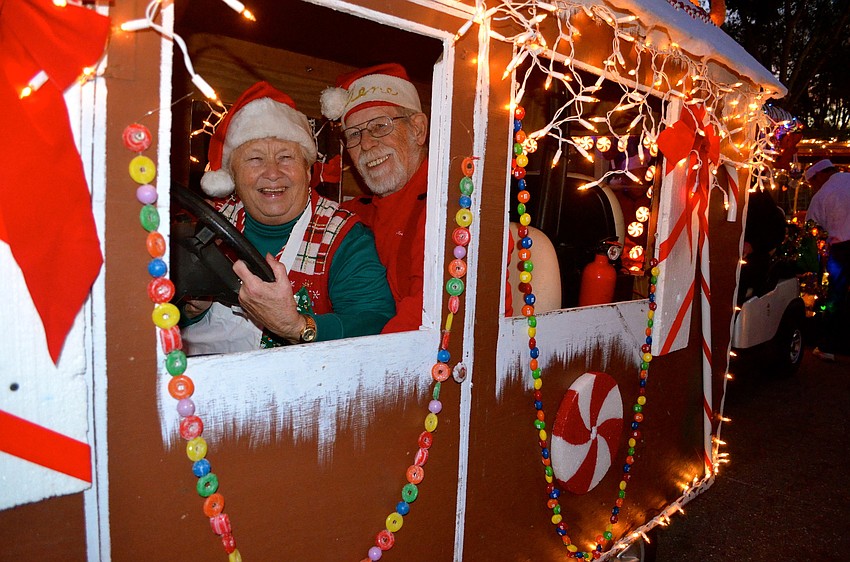 Jan and Gene Albrycht show off their gingerbread house â€”Â a staple in the parade.