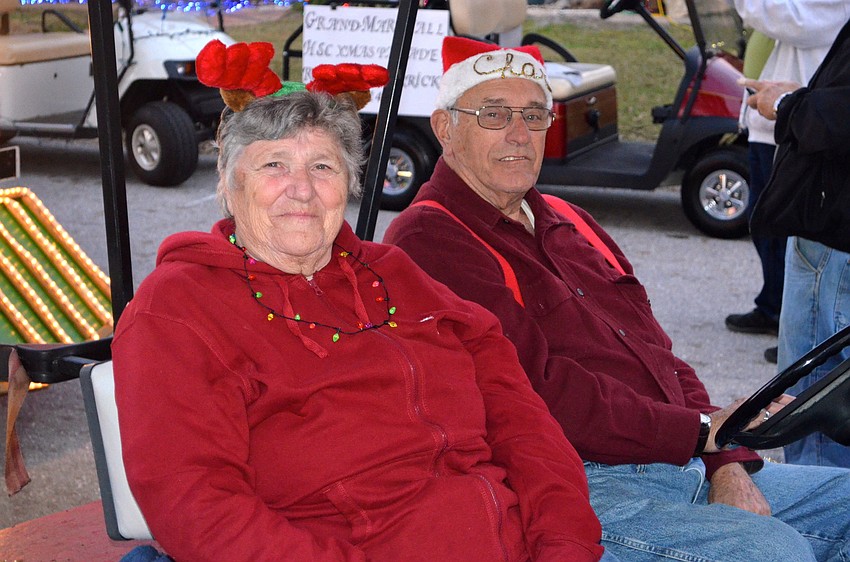 Helene and Charles Goetschius drive a fire department-themed cart.