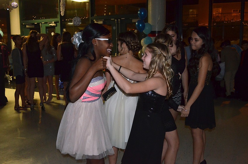 Ajanique Jones and Chloe Corleto dance to the music.