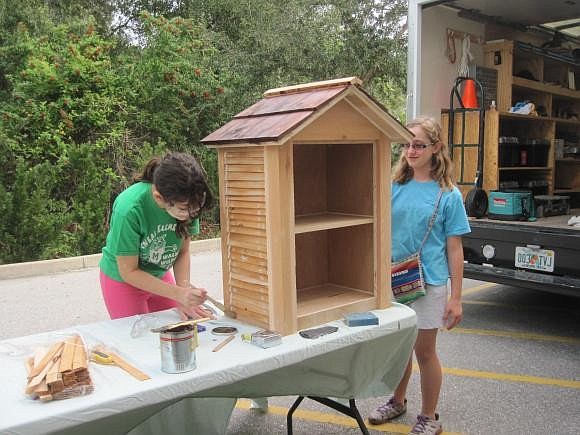 Courtesy photo, Nolan TSA students Naomi Burg and Amanda Boccarossa paint a little library to be installed at Greenbrook Park in Lakewood Ranch in January.