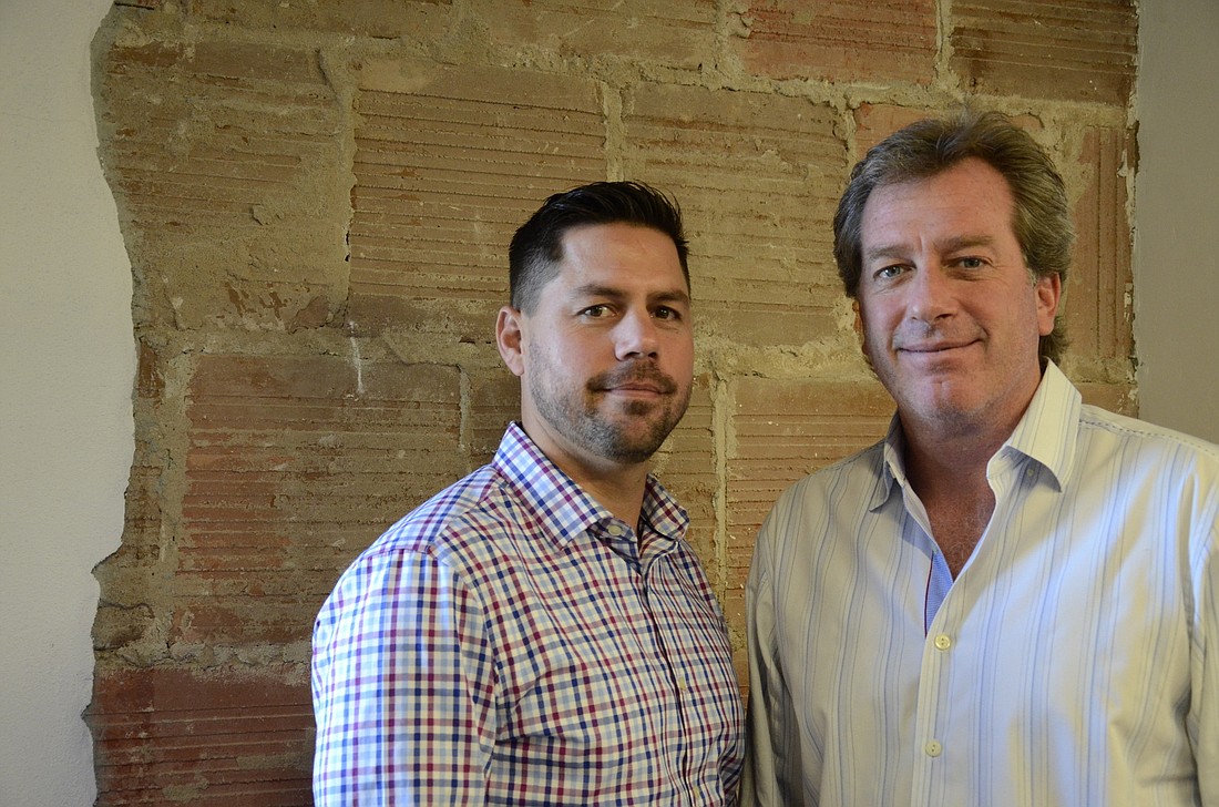 Local business owner Chris Brown, right, with business partner Mike Granthon, left, are prolific property investors.
