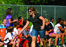 As one last hurrah for Tara Elementary fifth-grade students, the children competed against the school's faculty members and alumni in a kickball game, on a field tucked behind the East County school.