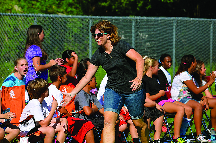 As one last hurrah for Tara Elementary fifth-grade students, the children competed against the school's faculty members and alumni in a kickball game, on a field tucked behind the East County school.
