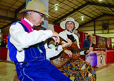 Ed and Geraldine Berbaum team up to play guitar and the fiddle for guests at the Manatee County Fair. 2