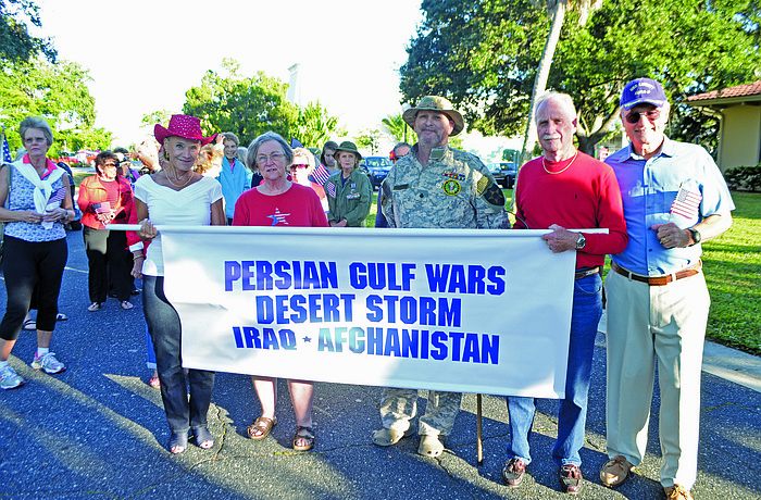 Sunny McGrath, Barbara Anne Manning, Craig Dropkin, Richard McGrath and Vietnam veteran Bob Hamel march in the inaugural Rotary Club of Longboat Key Veteranâ€™s Day Parade Nov. 11, on Bay Isles Road.