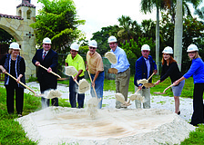 Lori Fountain, Peter Tuffo, Alcides Santiesteban, Eric Mauger, developer Jay Tallman, Mayor Jim Brown, Amy Drake and Angie Kimmich sport hardhats as they celebrate the groundbreaking of Aria condominium June 25.