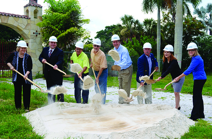 Lori Fountain, Peter Tuffo, Alcides Santiesteban, Eric Mauger, developer Jay Tallman, Mayor Jim Brown, Amy Drake and Angie Kimmich sport hardhats as they celebrate the groundbreaking of Aria condominium June 25.