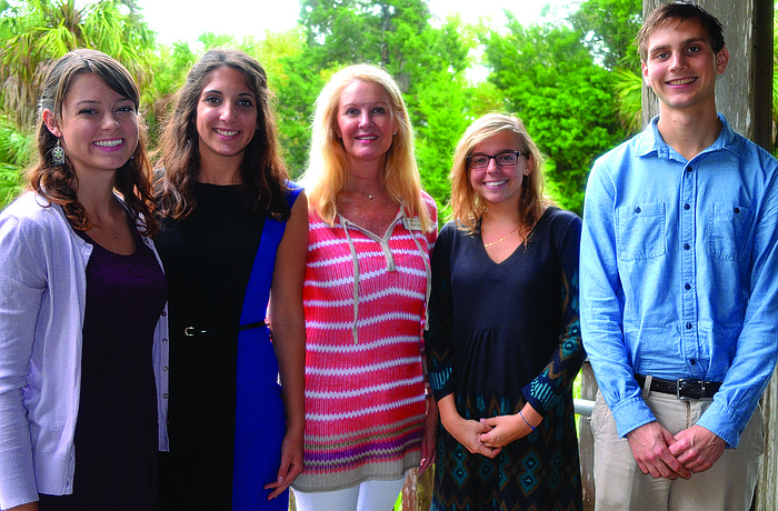 Susan Phillips, center, with Longboat Key Garden Club scholarship recipients, Abigail Oakes, Erika Smith, Isabella Soutullo and Nicolas Scheffer at the group's annual meeting and picnic April 8, at Joan M. Durante Park. 4