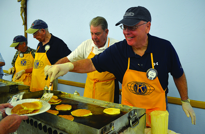 Joe Walsh serves pancakes with a smile at the Kiwanis Club of Longboat Key's annual pancake breakfast March 22, at St. Mary, Star of the Sea, Catholic Church.