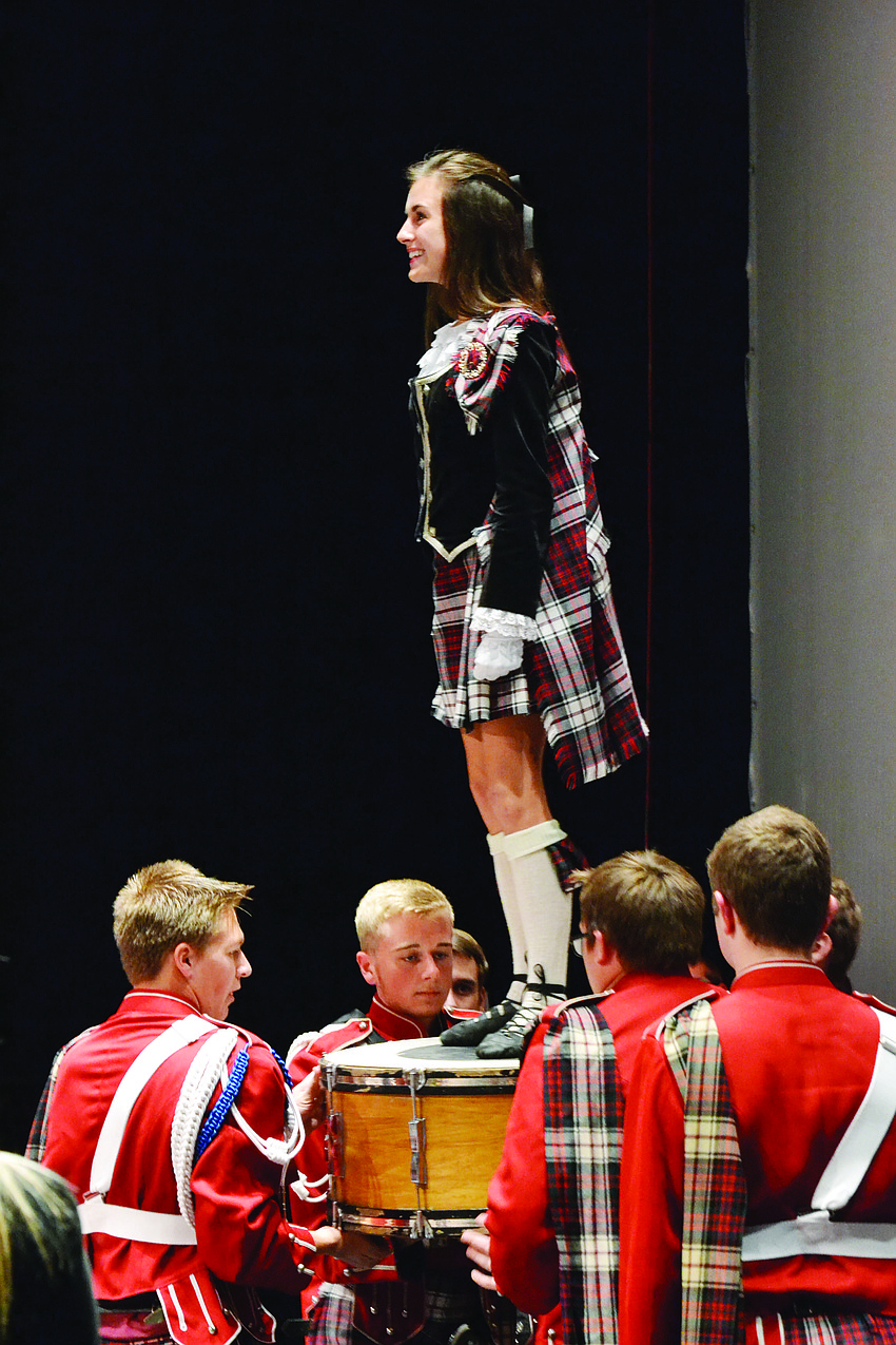Principal Highland dancer Stephanie Ciricillo dances on a drum members of the Kiltie band hold. The Riverview High School Kiltie Band and Wind Ensemble kicked off the school's 2014-2015 concert season.