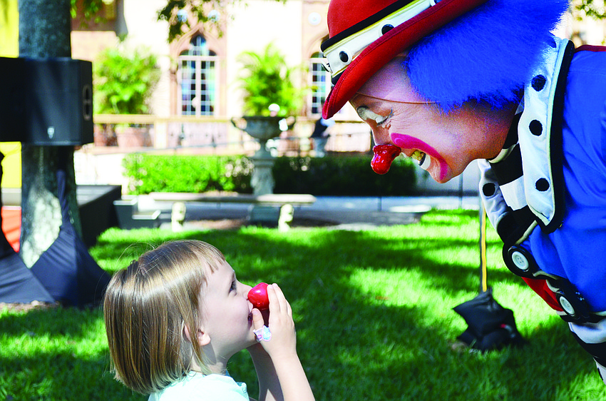 Lillian Weckerly meets clown Dave Gregg in May at the Ringling Museum. The U.S. Postal Service celebrated the Ringling Bros. and Barnum & Bailey Circus with the unveiling of its Vintage Circus Posters stamps.