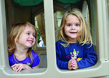 Lily Thiron and Ashlyn Shelson take a break from riding their tricycles at the Early Care Center of First United Methodist Church's annual St. Jude Trike-A-Thon.