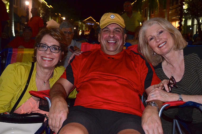 Vicki Sugar enjoys the music with Tony and Linda Delligatti.