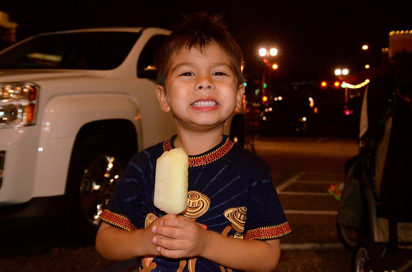 Luca Munoz snacks on a cold treat.