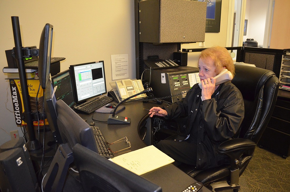 Former dispatcher Susan Young handles calls from the Longboat Key Police Department.