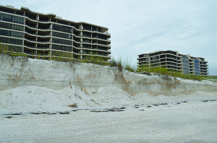 Erosion near condos such as L'Ambiance, pictured, at the south end continues to shrink the recreational beach, although sand dunes protect the structures. File photo
