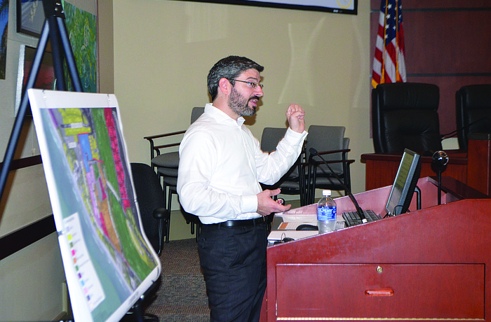 Evan Johnson, of Tindale-Oliver & Associates, discusses town center concepts at a Dec. 18 public workshop.