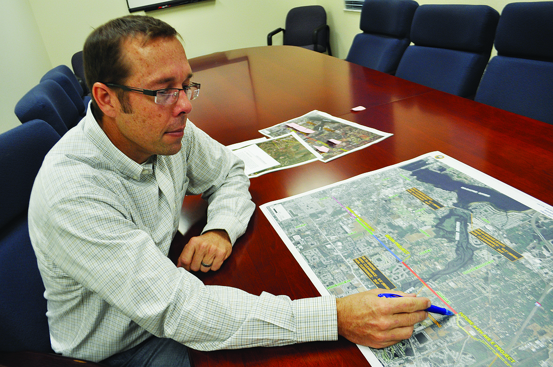 Manatee County Public Works Project Manager Kent Bontrager reviews plans for 44th Avenue East. Photo by Pam Eubanks