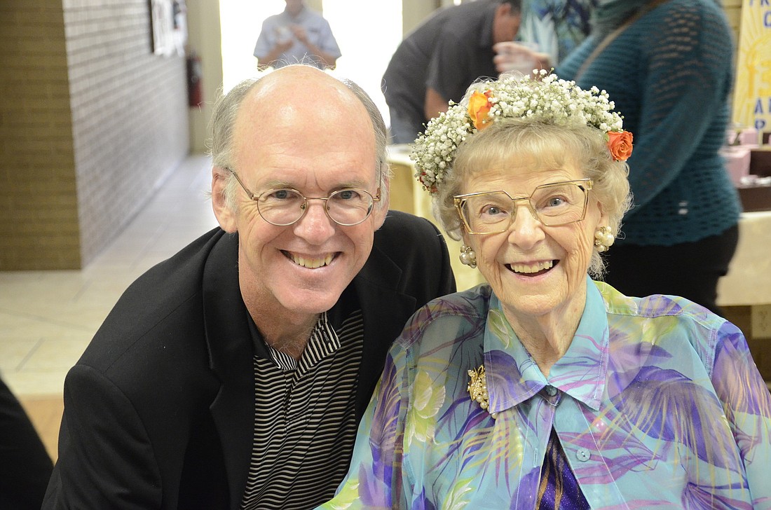 The Rev. Michael Mansperger wishes Norma Martin a happy birthday. Photo by Jessica Salmond