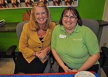Sue Abbott, of C1 Bank, and Michelle Reed, of Grow Financial, welcome guests.