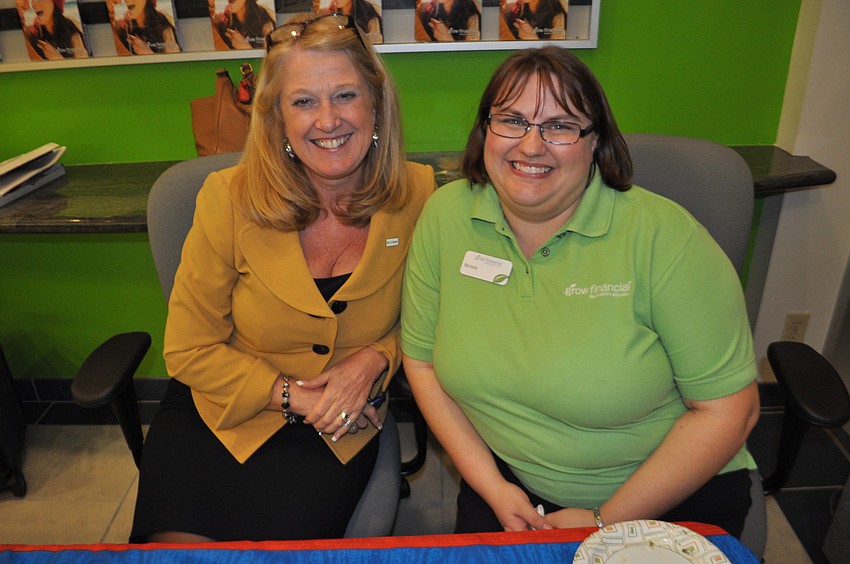 Sue Abbott, of C1 Bank, and Michelle Reed, of Grow Financial, welcome guests.