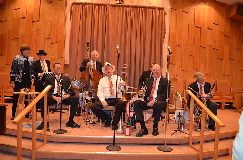 From left: pianist Mary Green, banjo player Ken Calhoun, clarinet player Jeff Green, bass player Don Mopsick, Kid Dutch, trumpet player Lew Green, drummer Mike Washington and saxophone and clarinet player Henry Blackburn
