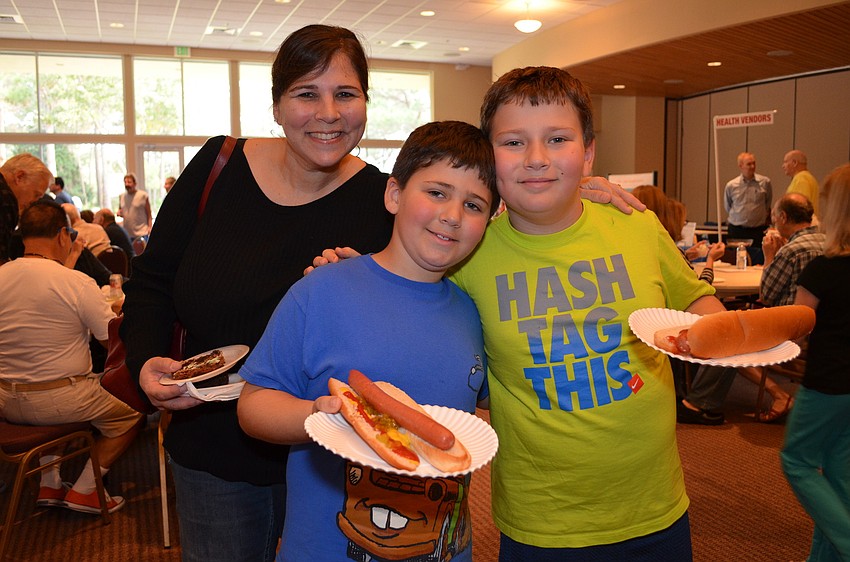 Renee Fletcher with her sons Jack and Max were excited to try hot dogs and dessert at the Jewish Food Festival.