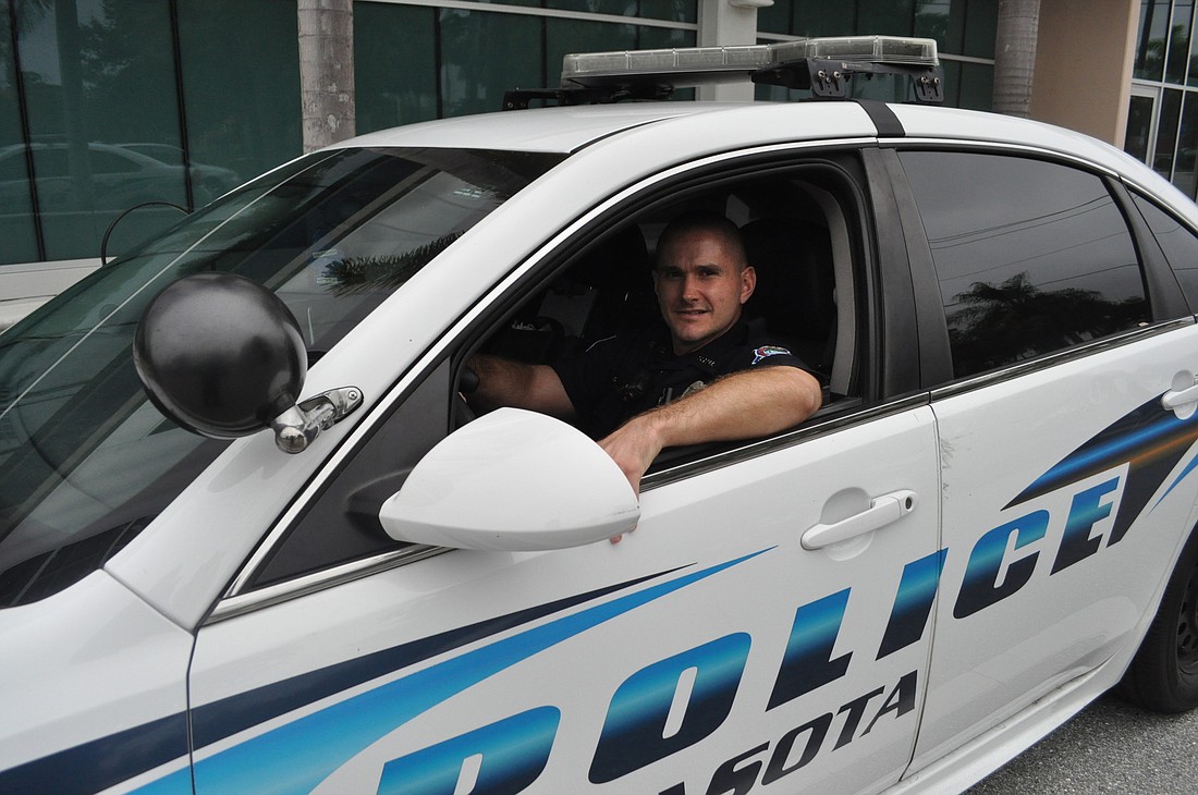 Patrol officers like J.D. Miller have taken on additional responsibilities as the Sarasota Police Department has undergone staffing cuts over the past several years. Photo by David Conway