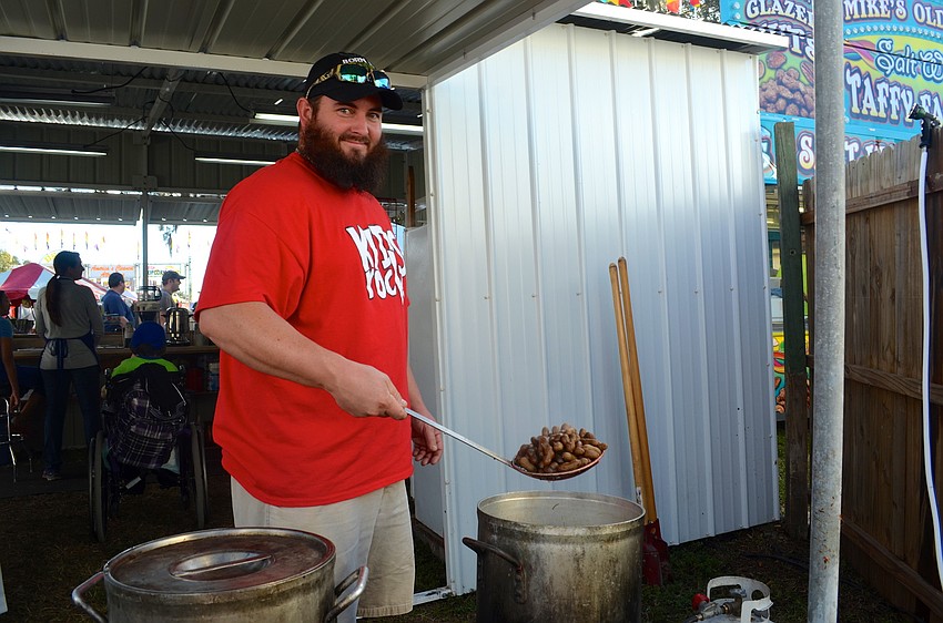 Lawrence Shackelford cooks up boiled cajun peanuts.