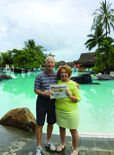 ISLAND TIME. Part-time Longboat Key residents John and Susan Franklin catch up on their Longboat Observer during a visit to Mo'orea Island in French Polynesia.