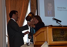 Alliance Chairman David Fink accepts the gavel and leadership position from former Chairwoman Annette Gueli.