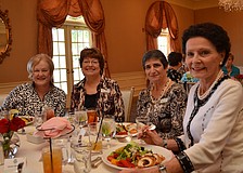 Margaret Wolohan, Carold Spalding, Janice Russo and Rita Polansky are seated for the Women's Club luncheon.
